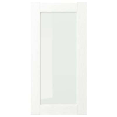 Exibe uma porta de armário ENKÖPING branca com uma textura subtil de veios de madeira e um painel de vidro retangular.
