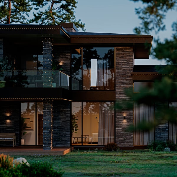 Casa moderna com luzes GETKÅL na varanda e fachada, brilho quente, exterior escuro, design elegante, vegetação.