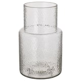 Um vaso KONSTFULL, transparente com vidro texturizado, desenhado por ilse crawford. Tem uma forma alta e cilíndrica com um pescoço mais estreito, ideal para flores.