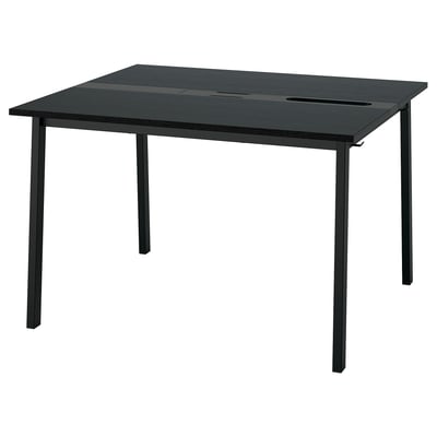 A mesa de conferência MITTZON é preta, retangular, com pernas de metal e possui gerenciamento de cabos embutido.
