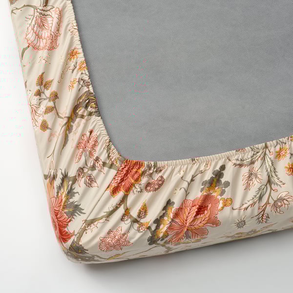 Lençol floral de canto em colchão cinza, exibindo tecido de algodão-viscose macio e decorativo com propriedades absorventes de umidade.