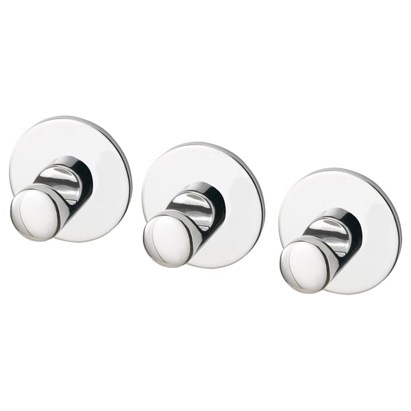 Três ganchos redondos com acabamento cromado com fita autoadesiva na parte de trás para montagem na parede. Design moderno e minimalista.