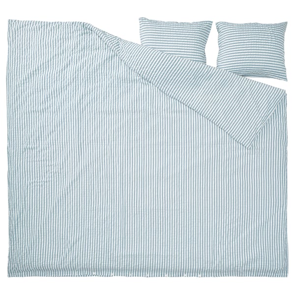 Conjunto de roupa de cama às riscas azuis com capa de edredão e fronhas em estilo seersucker, feito de algodão macio e mistura de viscose.