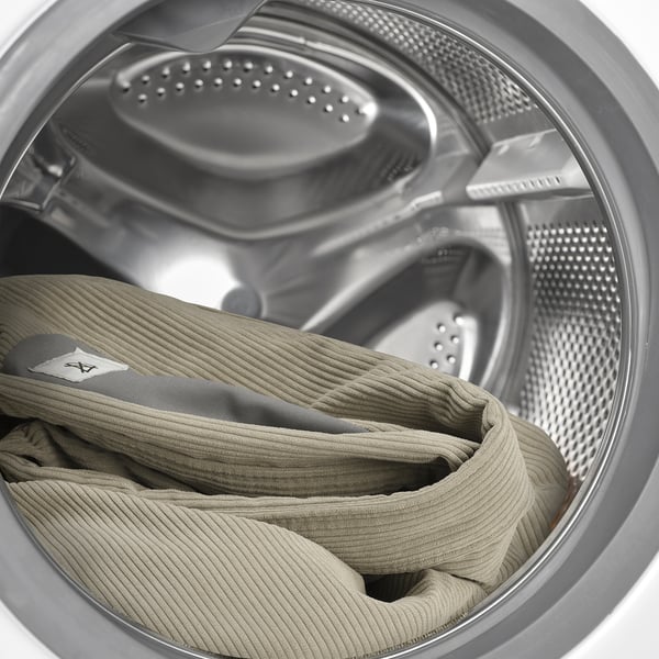 Capa de cama lavável na máquina em tecido elegante e macio assente em tambor de lavadora. Fácil de limpar para uso fresco.