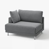 Um sofá UPPÅKRA cinzento com pernas metálicas elegantes, com um design moderno e macio.