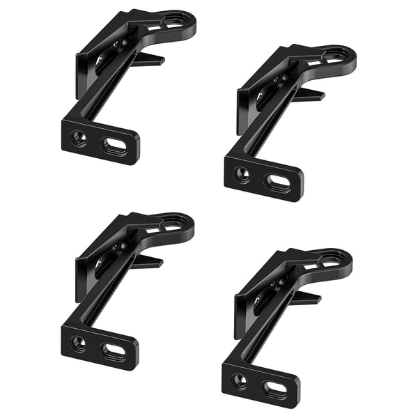 Quatro fechaduras de segurança para crianças UTRUSTA pretas dispostas num design quadrado, com acabamento fosco, em forma de Z angular feito de plástico.