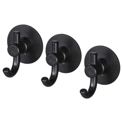 Três ganchos de parede pretos idênticos com bases redondas e designs de ganchos curvos, ideais para pendurar itens.
