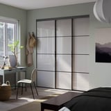 SKYTTA / PAX Walk-in wardrobe with sliding doors, black/Hokksund high-gloss light grey, 226x160x240 cm