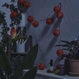 SOLVINDEN LED string light with 12 lights, outdoor/battery operated orange
