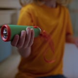MAJBAGGE Hand-powered LED torch, green/orange