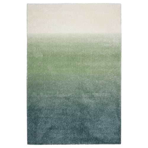 Omi HOTELLRUM rug: gradient blue-green-white, soft pile, rectangular, seamless design.