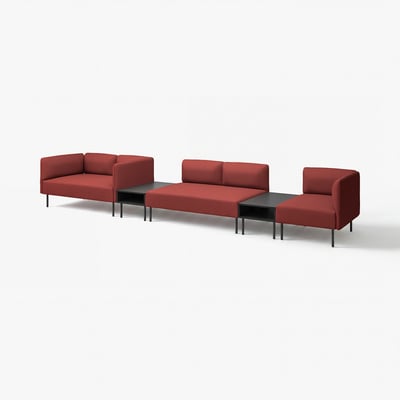Red modular sofa set with black tables, modern minimalist design.