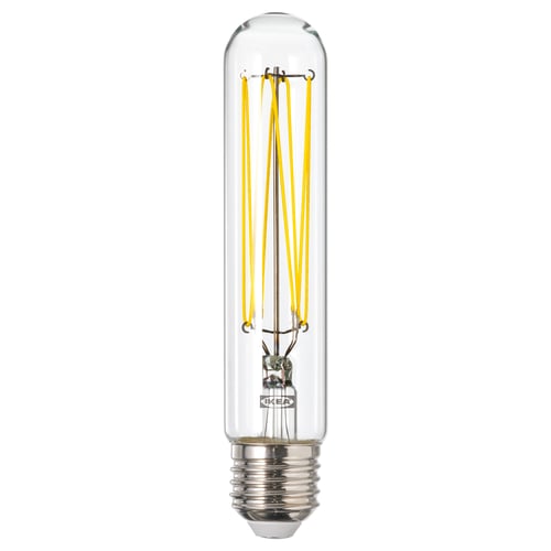 LUNNOM light bulb. Clear glass, yellow filament, cylindrical shape.