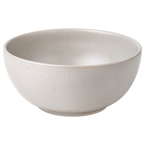 Handcrafted white bowl with black dots, round shape, made of glazed stoneware for serving food.