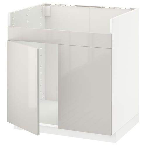 A white METOD kitchen cabinet. It has a high gloss finish and a modern, sleek design with clean lines.