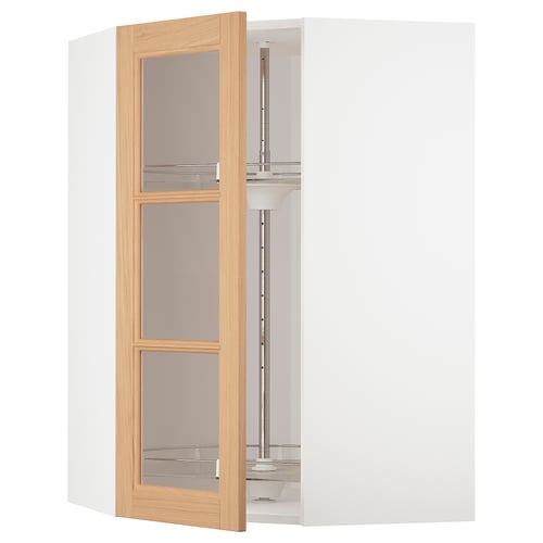 An open white METOD kitchen cabinet with vedhamn glass doors in oak. It has an adjustable glass shelf and sturdy frame construction.