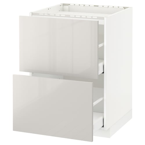 White METOD kitchen cabinet with two open drawers in modern design.