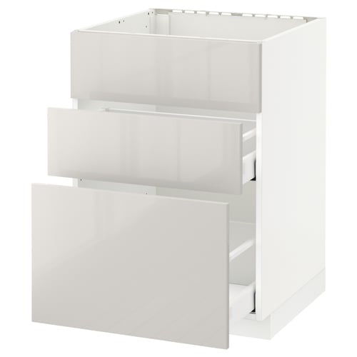 A white METOD kitchen cabinet with one open drawer.