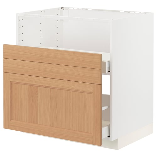 White and oak ikea METOD kitchen cabinet with three drawers.