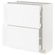 White METOD kitchen cabinet, flat panel design, with partially open drawers.