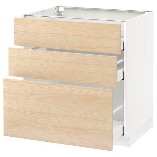 A white METOD kitchen cabinet with three light ash wood drawers.