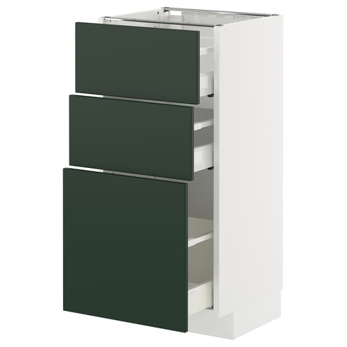 Modern kitchen unit with three green drawers, sleek design, white frame.