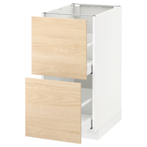 A white METOD kitchen cabinet with two light ash wood-colored drawers.