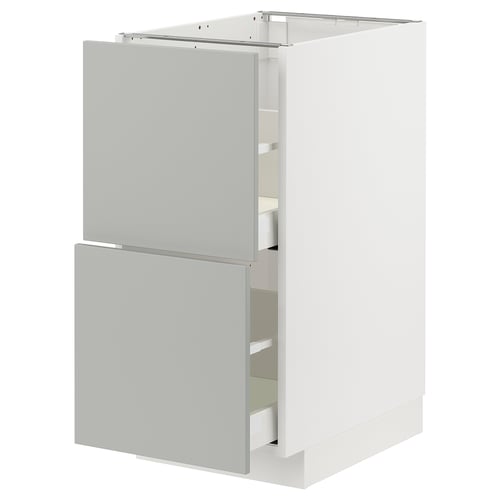 Modern white METOD kitchen cabinet with two light grey drawers & door.