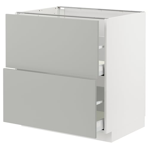 White METOD kitchen cabinet with grey drawers.