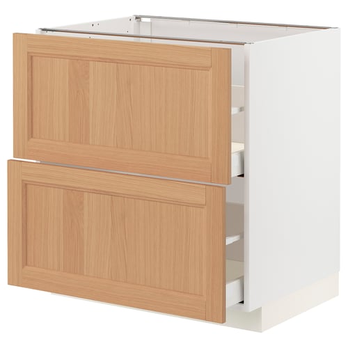 METOD kitchen cabinet with oak drawers and white frame.