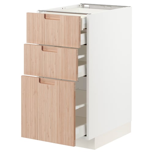 Modern white ikea kitchen cabinet with 3 light wood drawers, partially open, showing storage compartments.