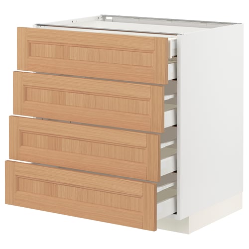 An ikea METOD kitchen unit with four wooden drawers in a light oak finish. Its part of a white cabinet, ideal for kitchen storage.