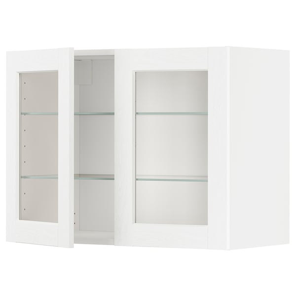White METOD kitchen cabinet with glass doors and shelves.