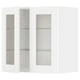 A white METOD kitchen cabinet with glass doors, featuring a classic design with adjustable shelves.