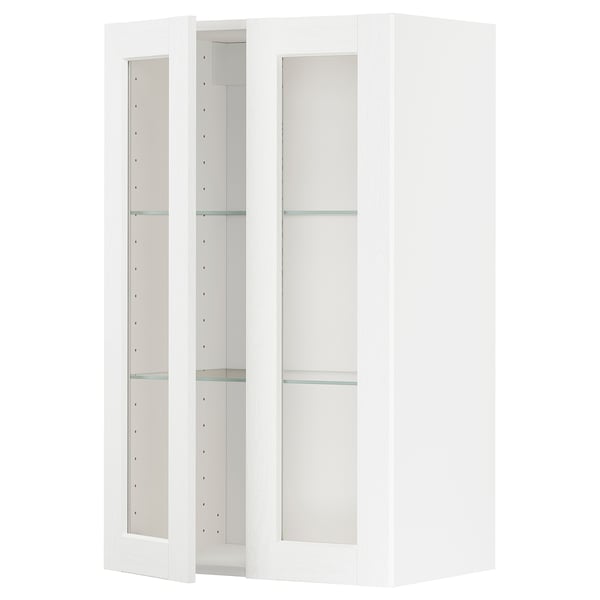 White METOD kitchen cabinet with glass doors, modern minimalist design.