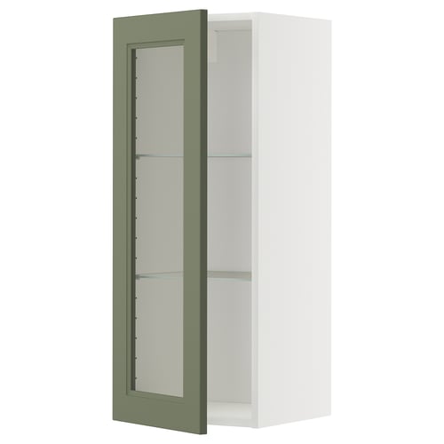 A METOD kitchen cabinet with an axstad glass door in gray-green, featuring adjustable shelves.