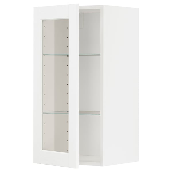 White METOD kitchen cabinet with glass door and adjustable shelf.