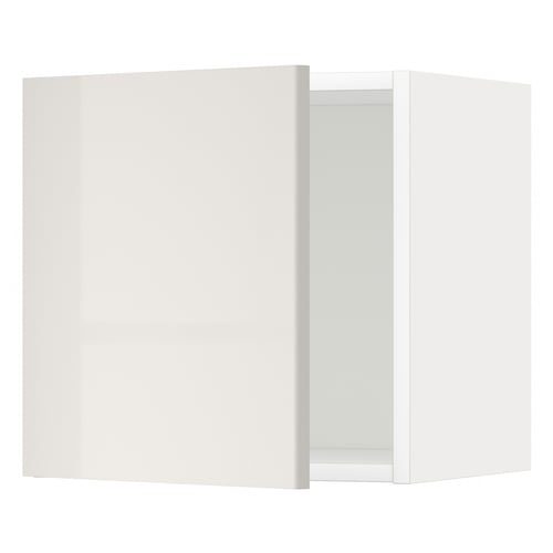 Modern, glossy white wall cabinet, slightly ajar in kitchen.