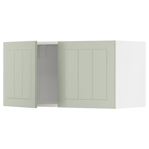 METOD kitchen unit in green. Two closed panels, one open revealing shelves.