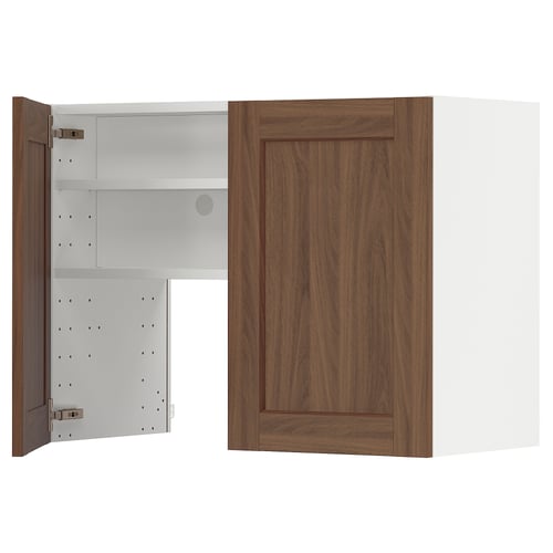 A wooden METOD kitchen cabinet with an open door revealing white shelves. It a walnut finish, adjustable shelves, and a modern design.
