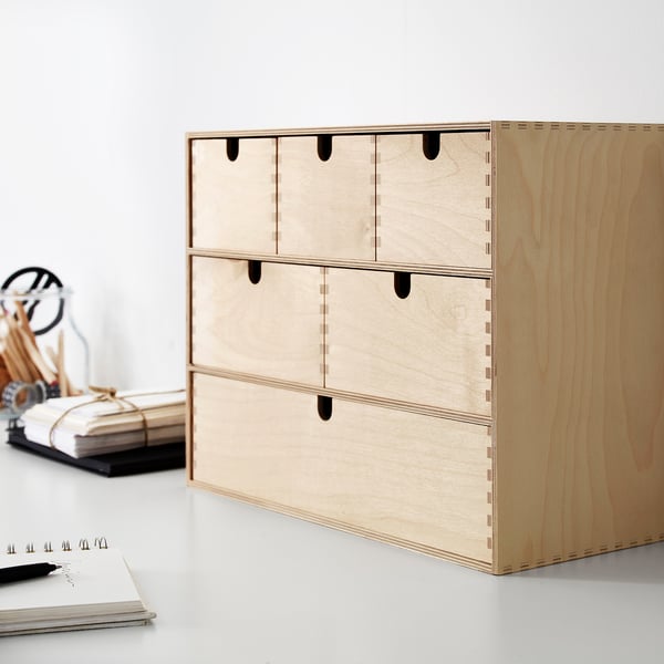 Wooden MOPPE mini chest of light-colored wood with multiple small drawers, neatly organised with a modern simple design.