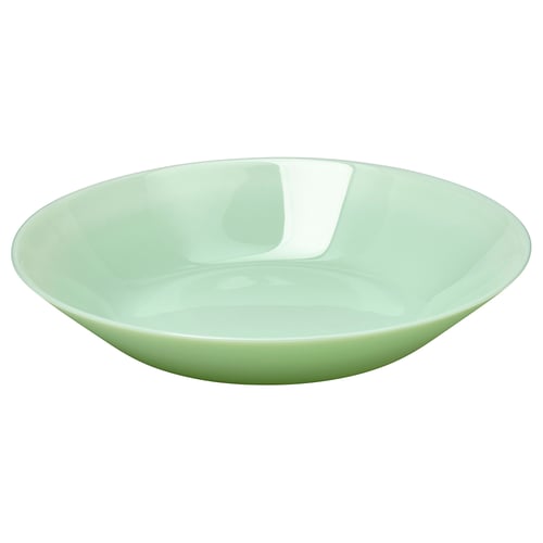 Green glass bowl, modern design, smooth edges.