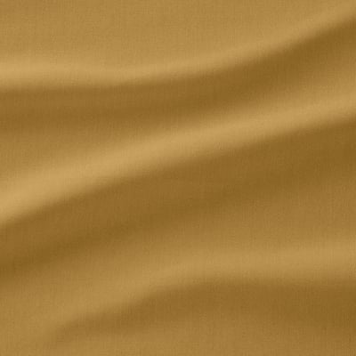 Close-up of golden fabric, soft and detailed, showcasing its high-quality texture.