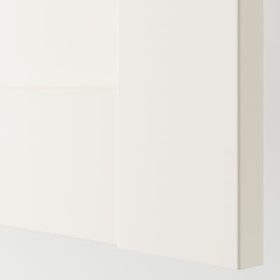 White wardrobe section, part of a modular storage system. Sleek, modern design with smooth, clean surfaces, reflecting high-quality craftsmanship.