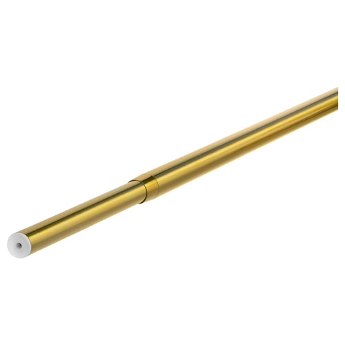 Brass-colored metal adjustable curtain rod laid diagonally.