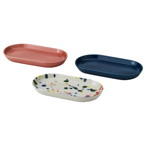 Three colourful serving plates; red, blue, multicoloured. Oval-shaped stoneware with glazed finish.