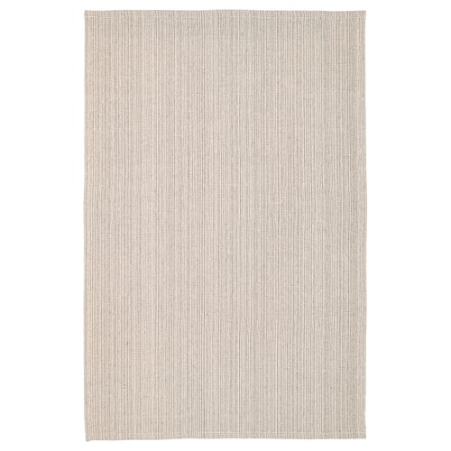 A rectangular, beige TIPHEDE cotton rug. Its simple, flat-woven design is ideal for living rooms or dining areas.