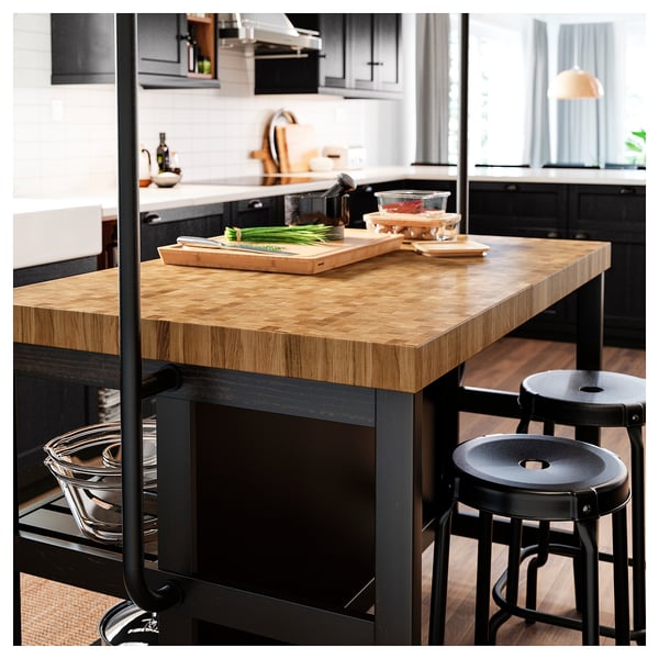 VADHOLMA Kitchen island with rack, black/oak, 126x79x193 cm