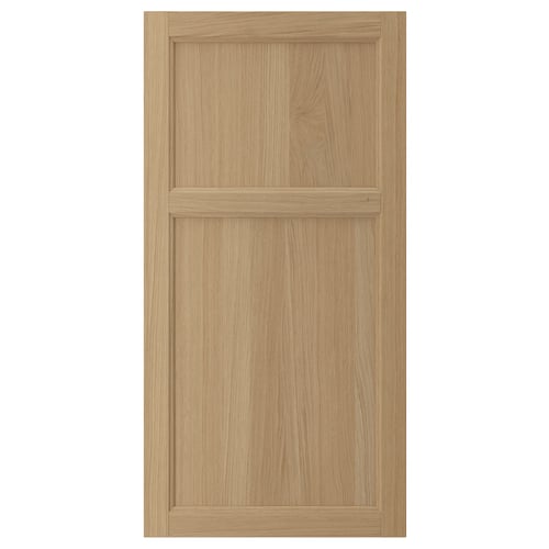 VEDHAMN natural wood cabinet door with oak panel and frame. Simple, rectangular design showcasing wood grain.