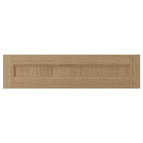 Natural wood kitchen drawer front with oak finish and solid wood frame. Simple, rectangular design.